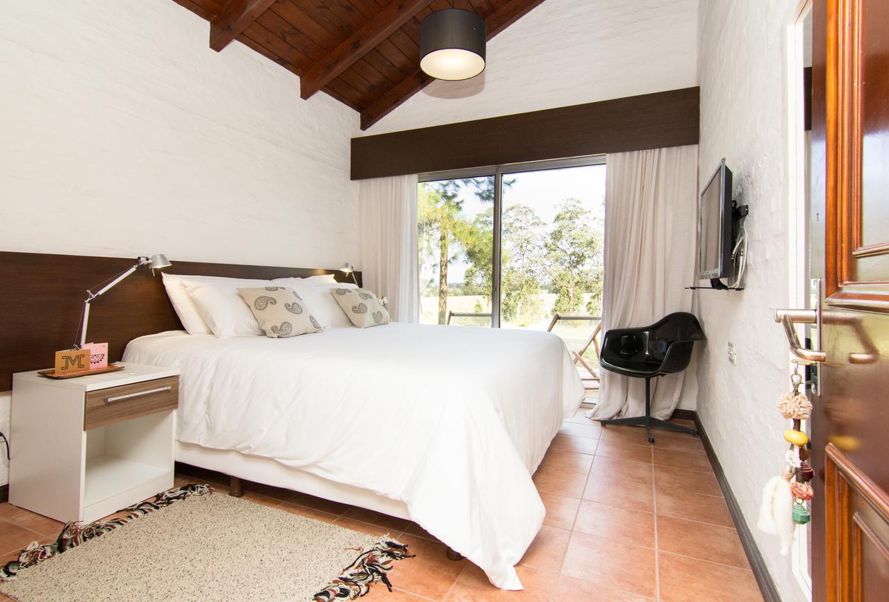 Posada Mosaico Villas Garzon Habitación foto